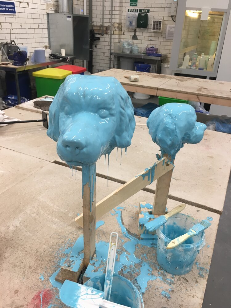 cast dog heads dripping silicon